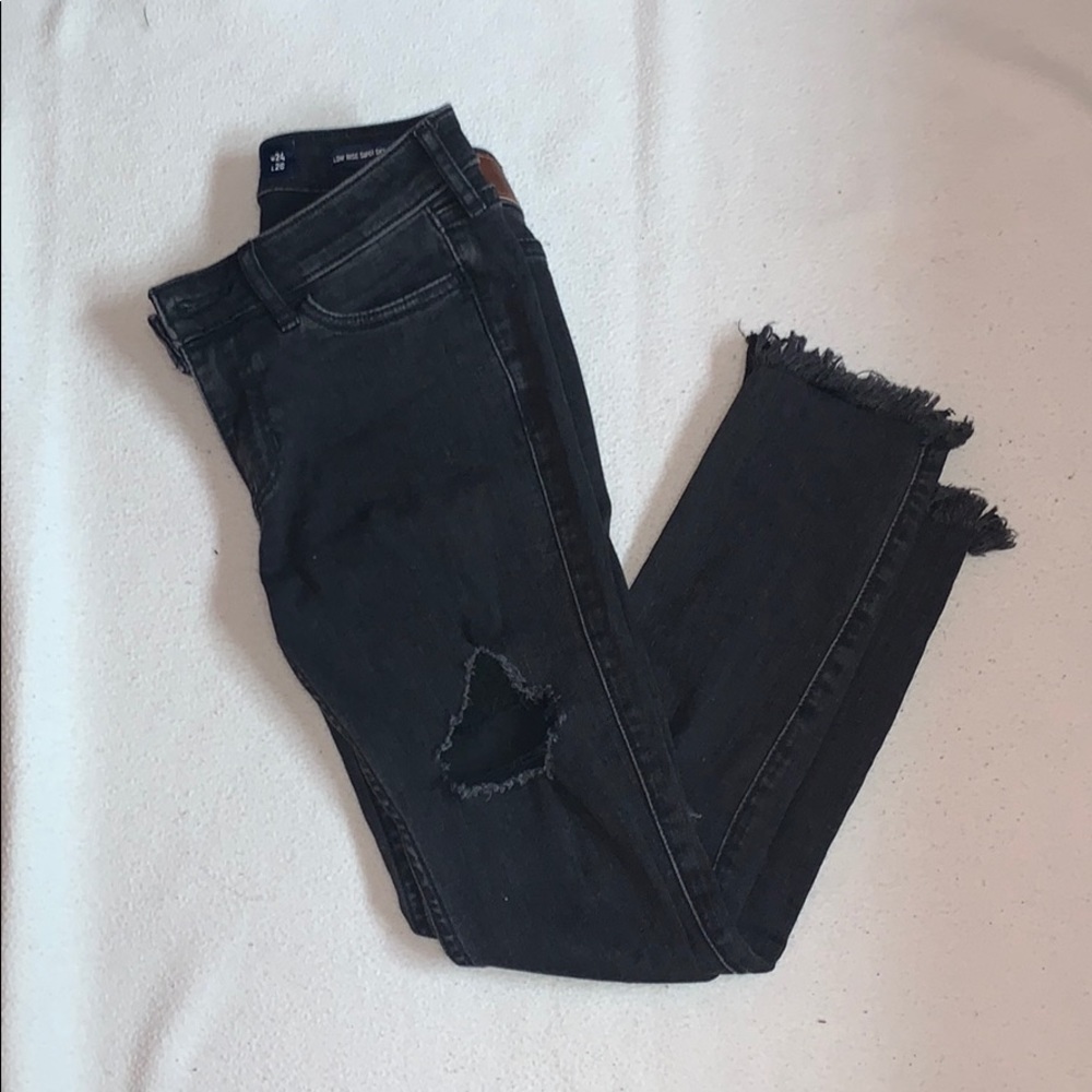 Cropped distressed low-rise skinny jeans